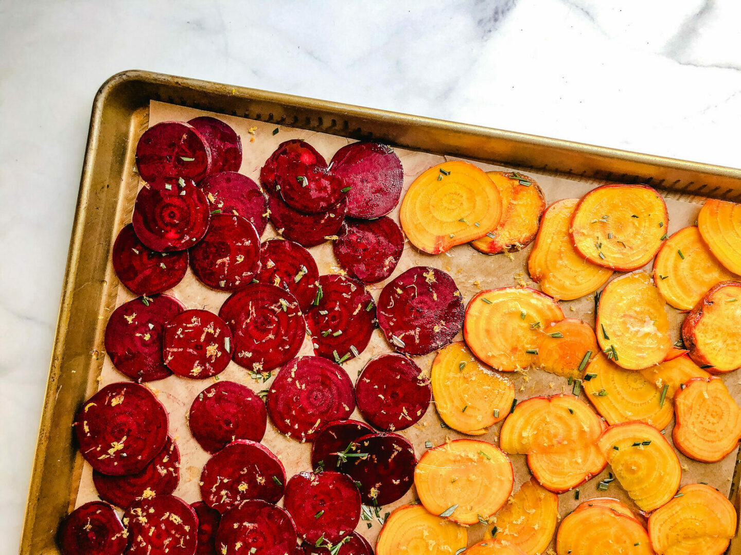 rosemary lemon beet chips on a baking sheet