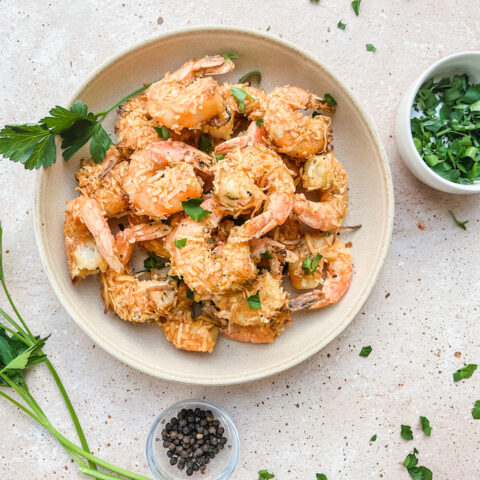 Paleo healthy coconut shrimp in white bowls