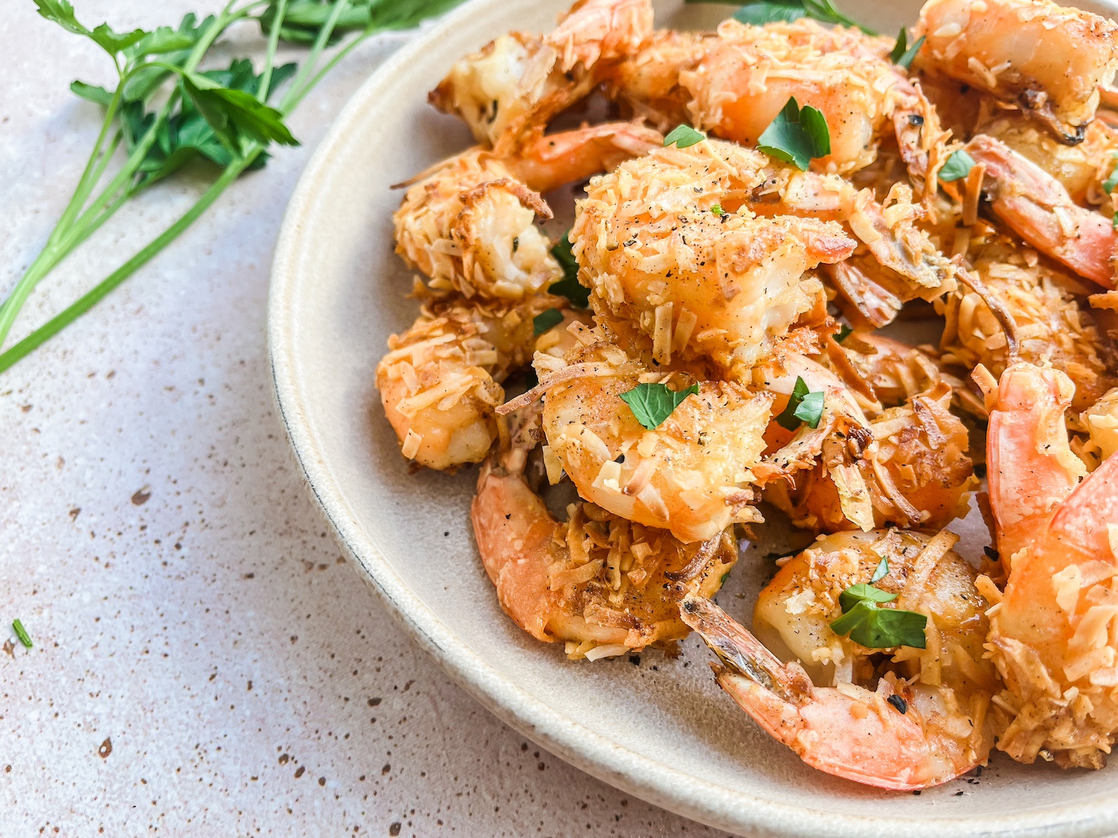 Coconut shrimp final photo plated with cilantro. 