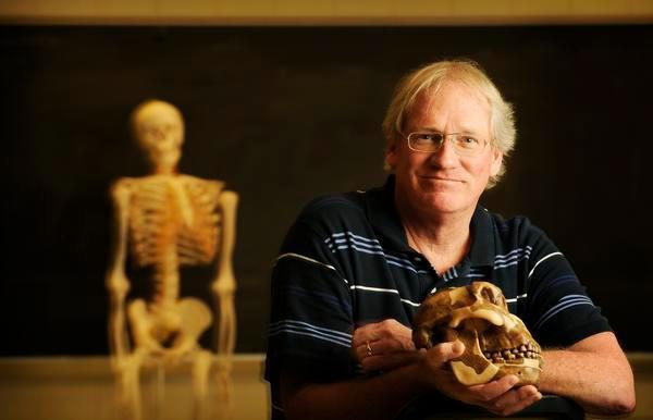 Dr Loren Cordain holding a Paleolithic skull