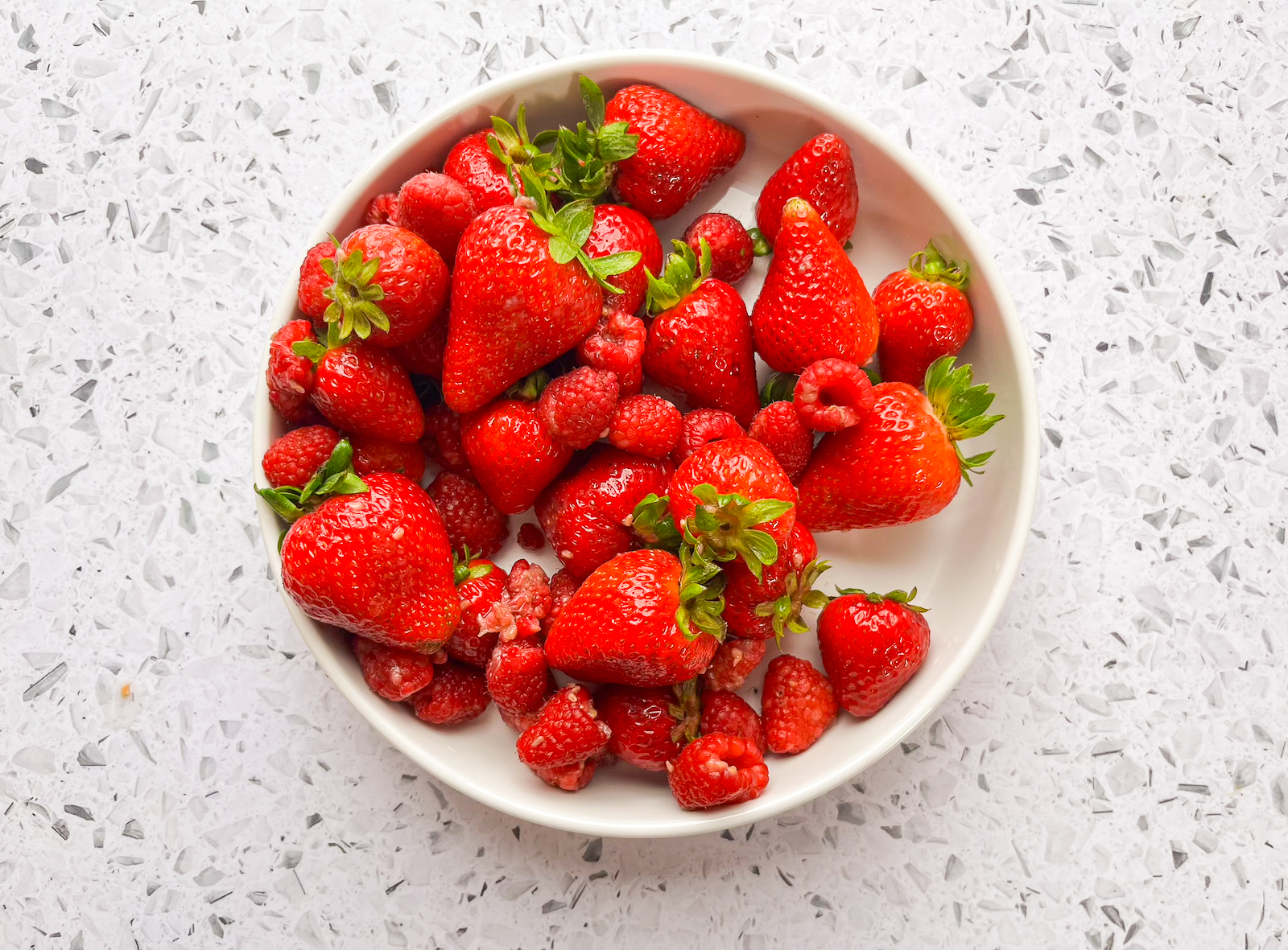 Berries strained and plated after produce wash