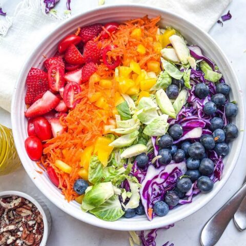 Birdseye view of rainbow salad before mixing