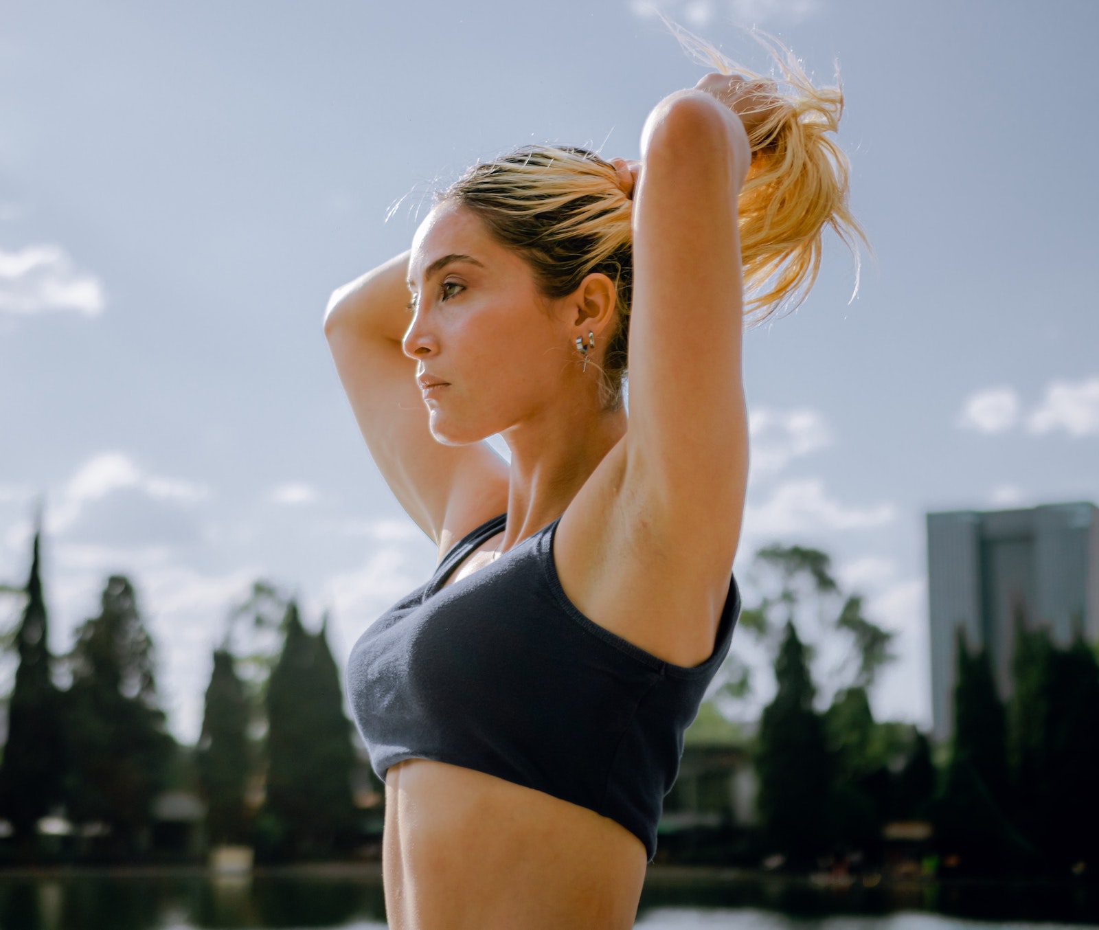 women putting up her hair before a run